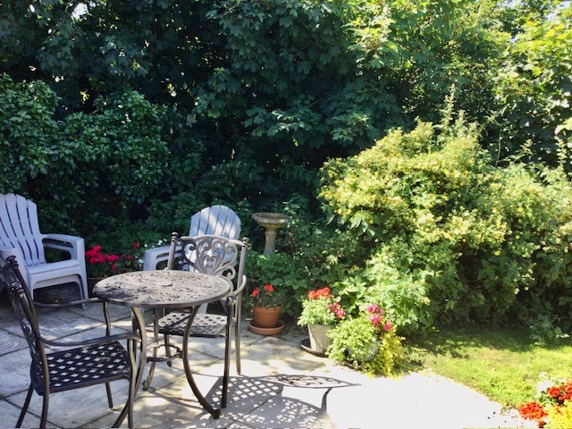 Patio and garden at Hollyhocks Bungalow Holiday Accommodation Welcombe North Devon