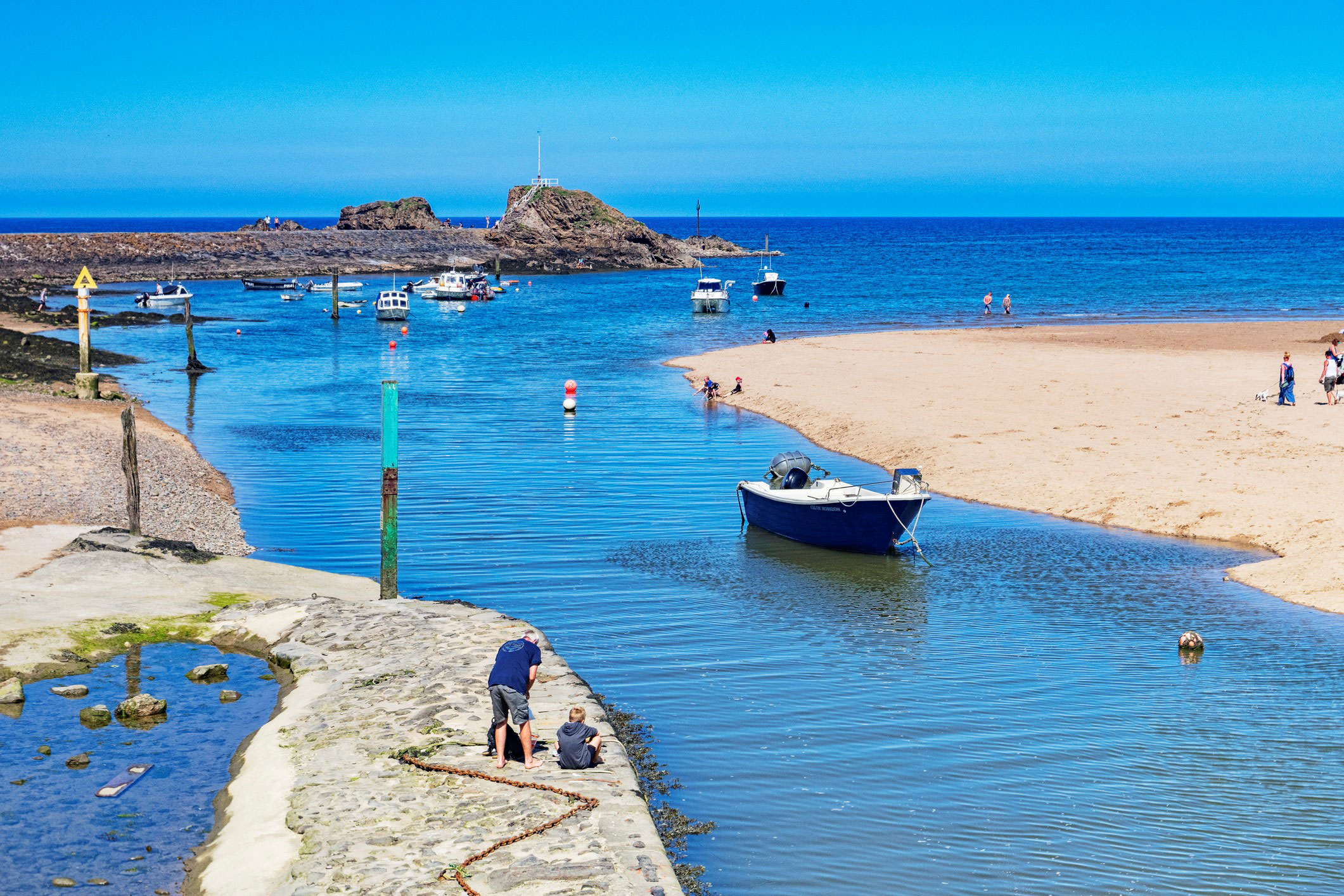 Bude canal going out to sea.  Bude beach  seasonal   designated areas dog friendly Beach